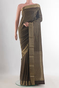 Brown Mysore Crepe Saree with Zari Brocade on the body and Zari Border.  displayed on a mannequin
