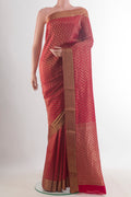 Red Mysore Crepe Saree with Zari Brocade on the body and Zari Border.  displayed on a mannequin