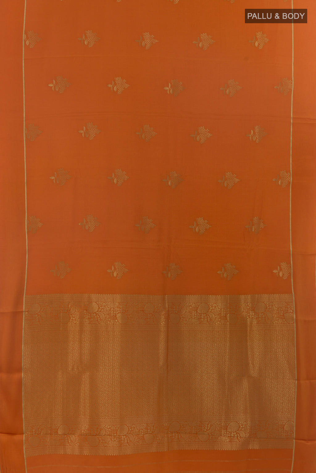 Flat view of Orange Mysore Crepe Saree with Zari Butta on the body and Zari Border. 