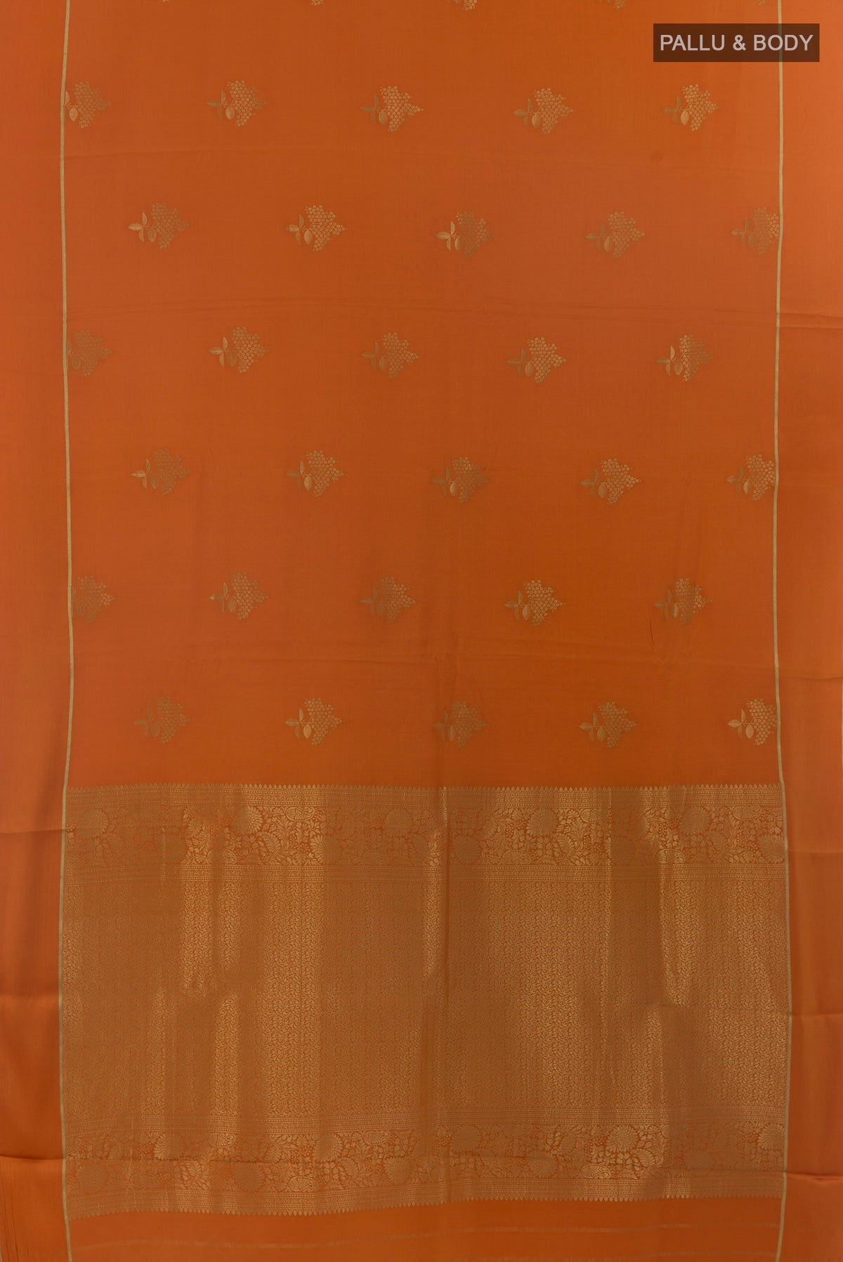 Flat view of Orange Mysore Crepe Saree with Zari Butta on the body and Zari Border. 