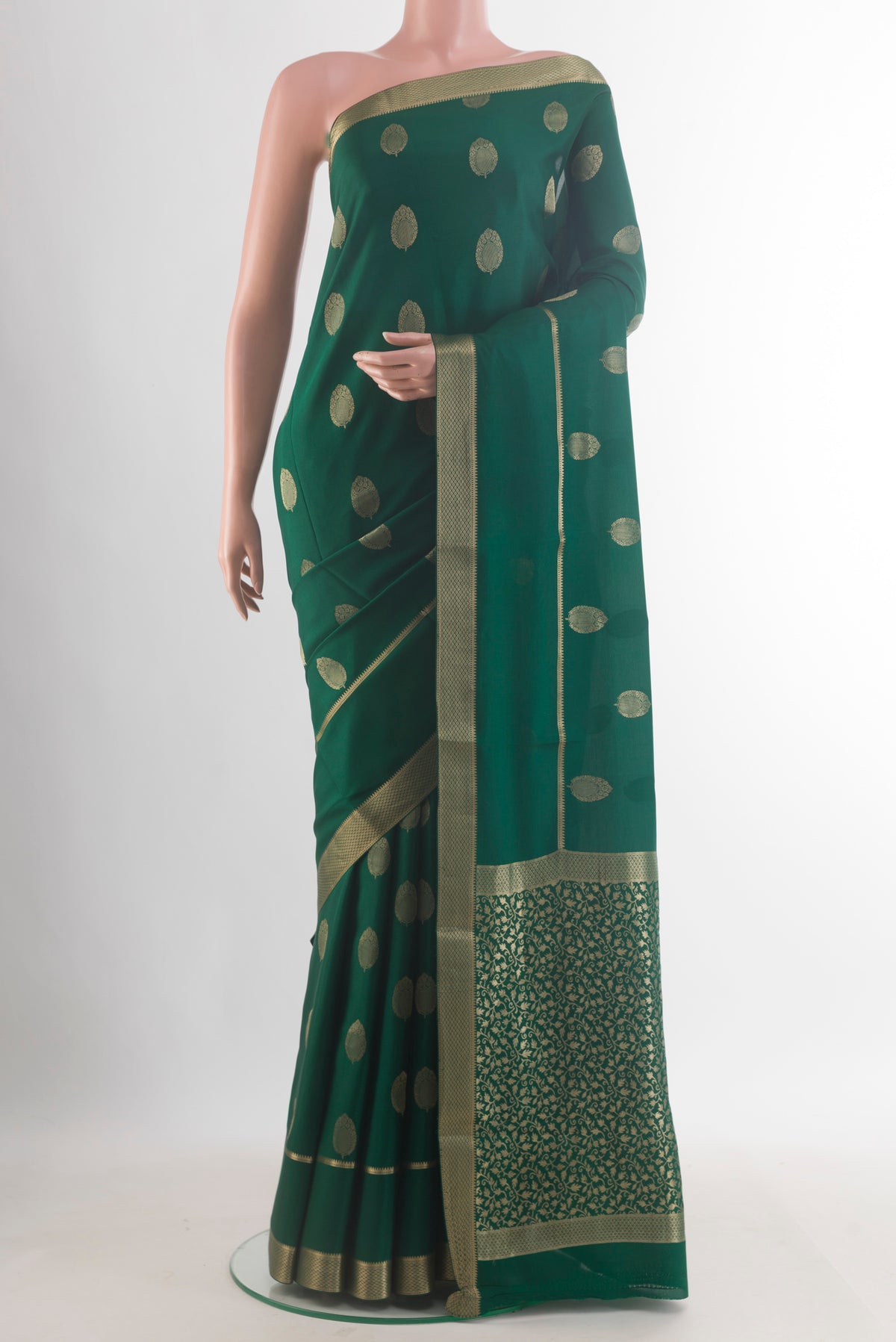 Green Mysore Crepe Saree with Zari Butta on the body and Zari Border.  displayed on a mannequin