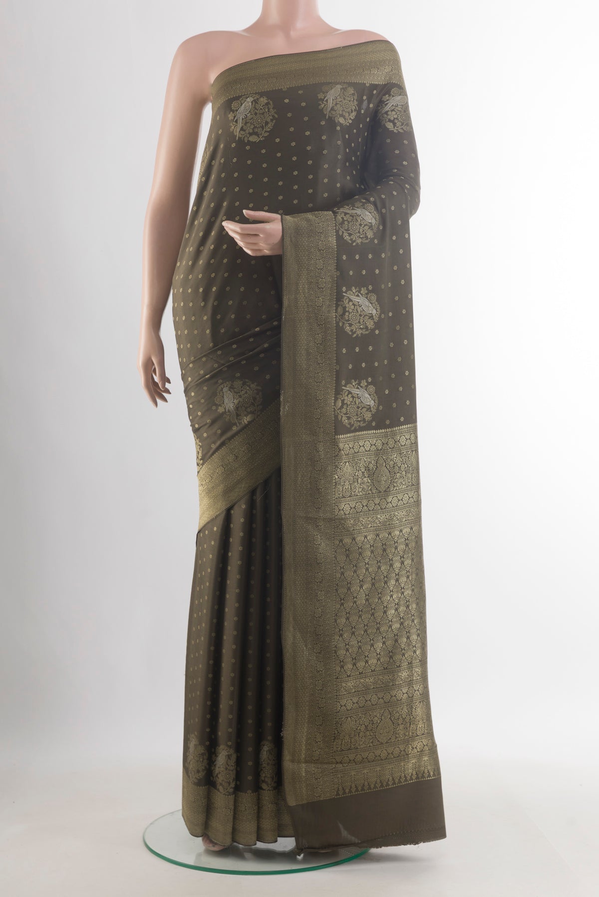 Mehandi Green Mysore Crepe Saree with Zari Butta on the body and Zari Border.  displayed on a mannequin