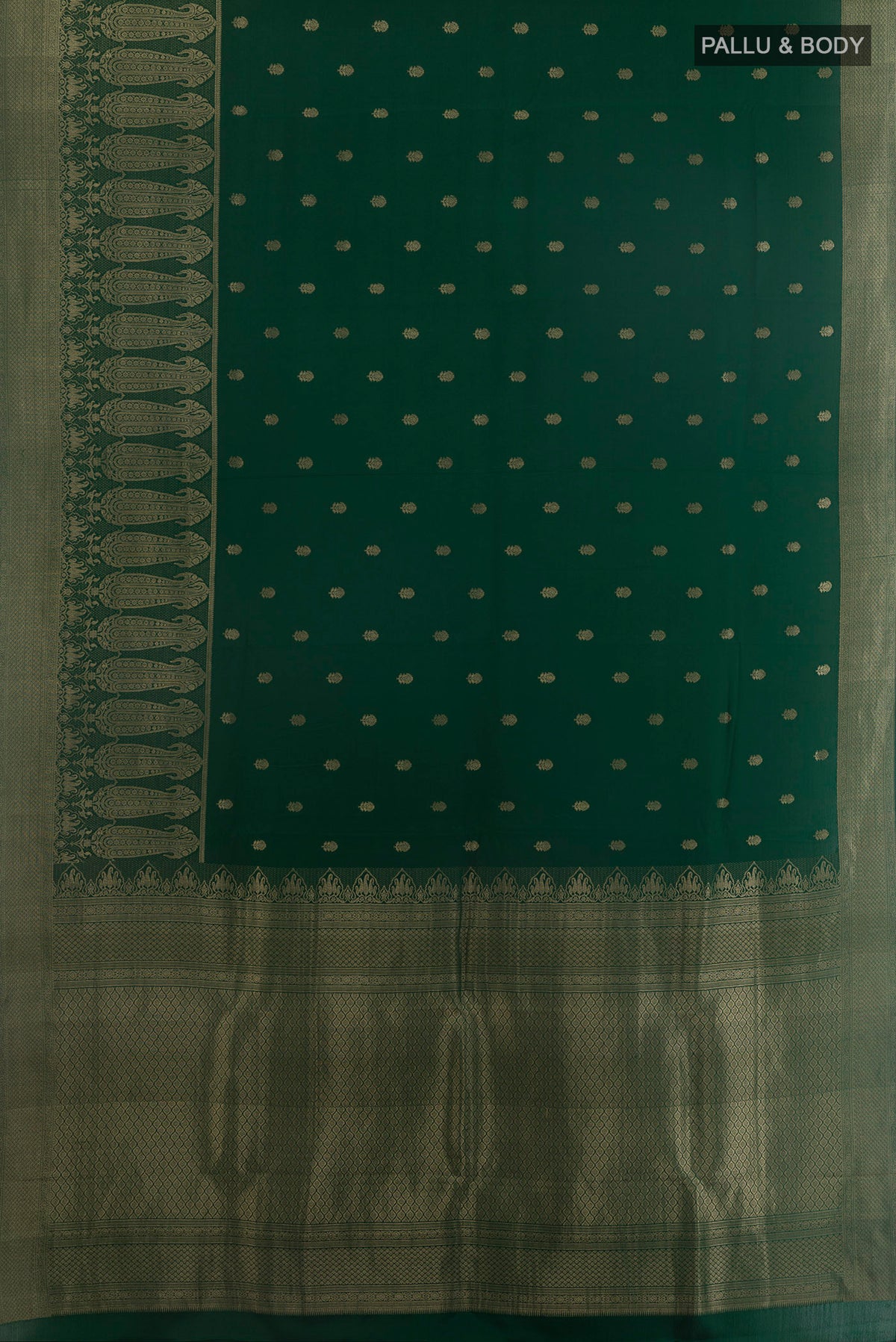 Flat view of Bottle Green Mysore Crepe Saree with Zari Butta on the body and Zari Border. 