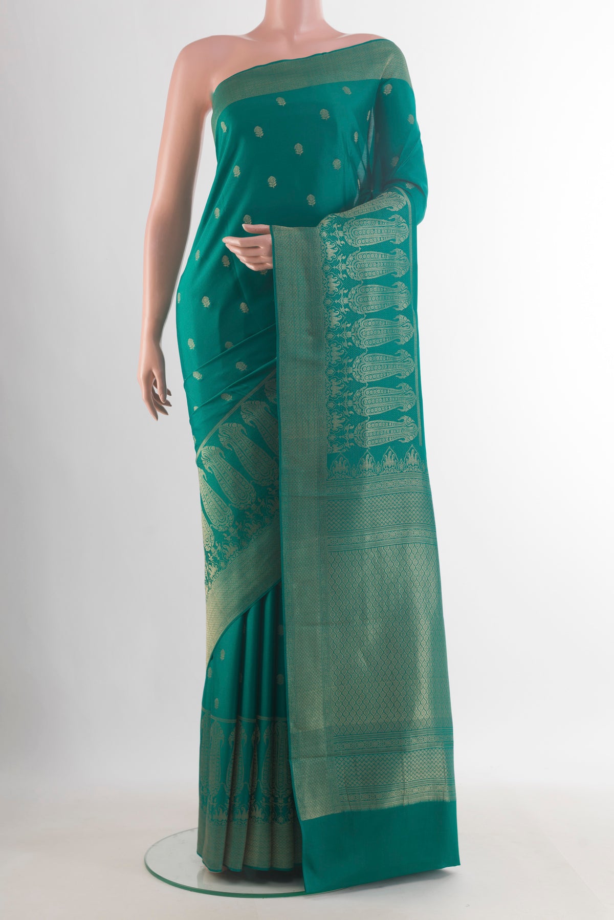 Sea Green Mysore Crepe Saree with Zari Butta on the body and Zari Border.  displayed on a mannequin