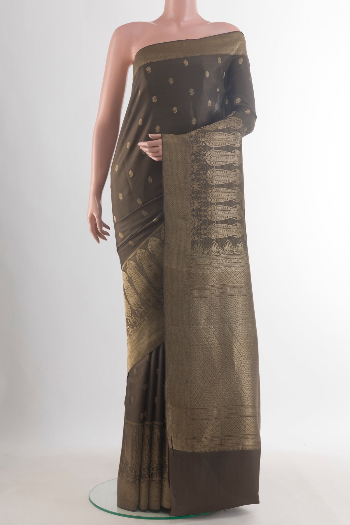 Mehandi Green Mysore Crepe Saree with Zari Butta on the body and Zari Border.  displayed on a mannequin