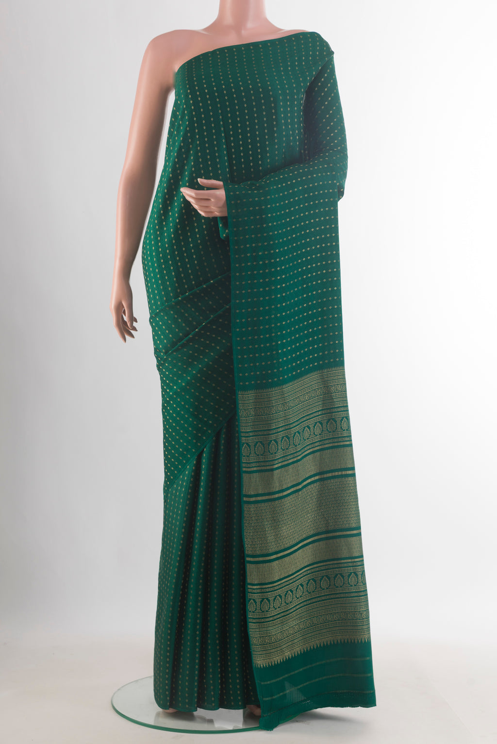 Green Mysore Crepe Saree with Zari Butta on the body and Without Border.  displayed on a mannequin