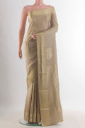 Beige Mysore Crepe Saree with Zari Butta on the body and Zari Border.  displayed on a mannequin