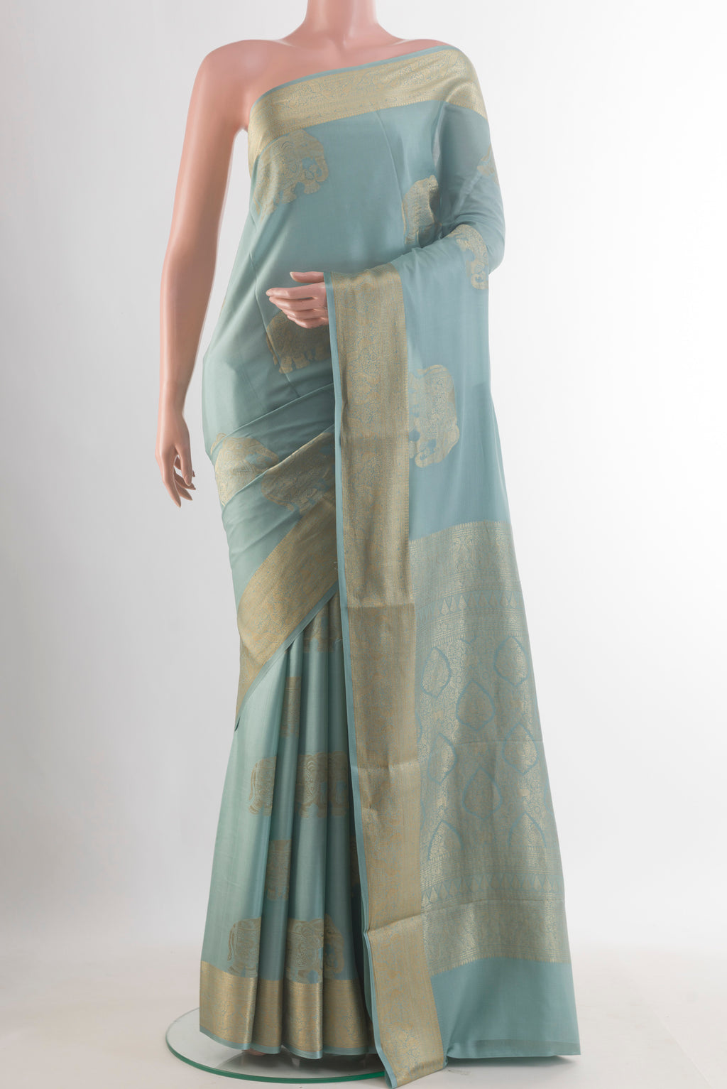 Light Blue Mysore Crepe Saree with Zari Butta on the body and Zari Border.  displayed on a mannequin