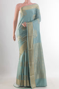 Light Blue Mysore Crepe Saree with Zari Butta on the body and Zari Border.  displayed on a mannequin