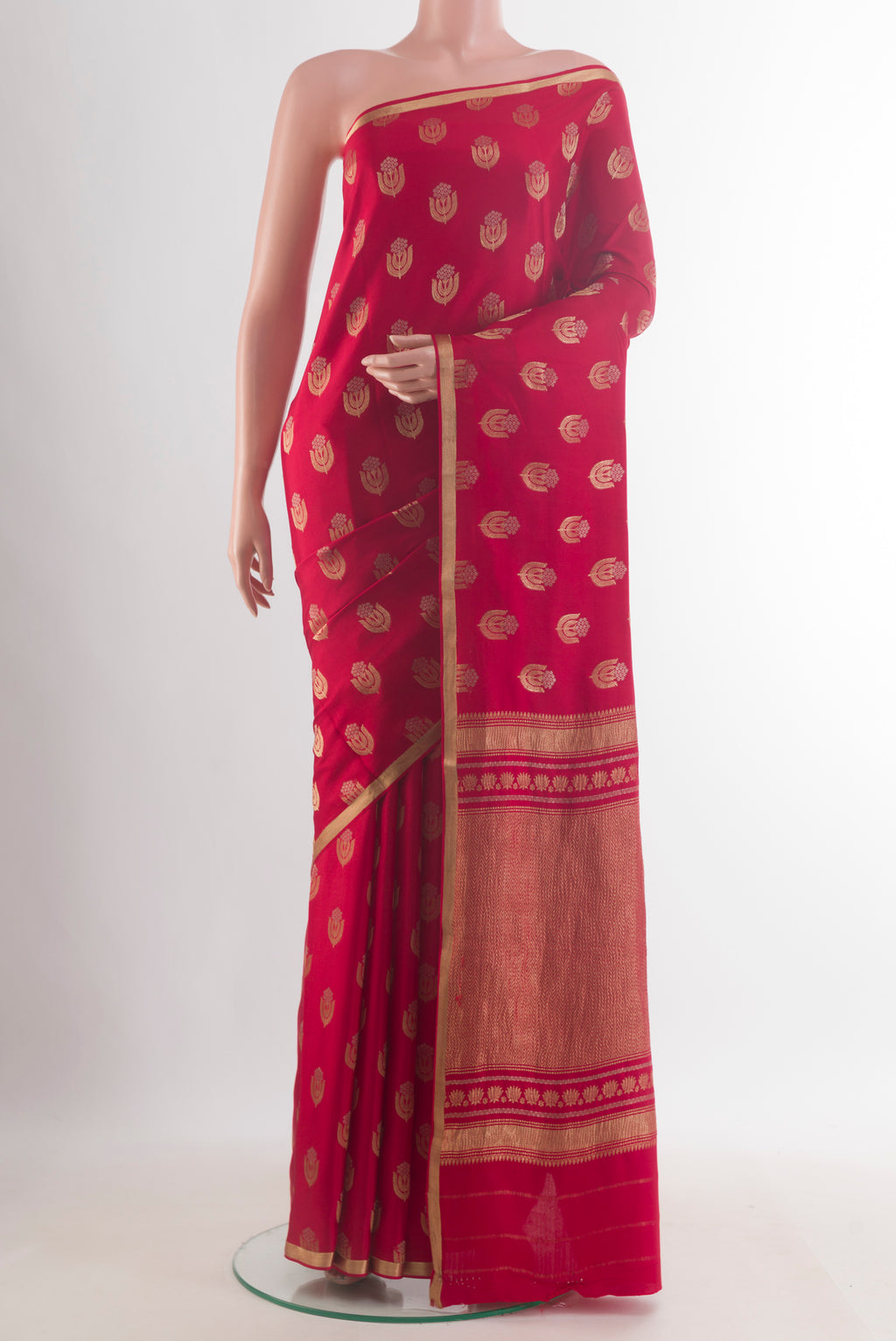 Red Mysore Crepe Saree with Zari Butta on the body and Zari Border.  displayed on a mannequin