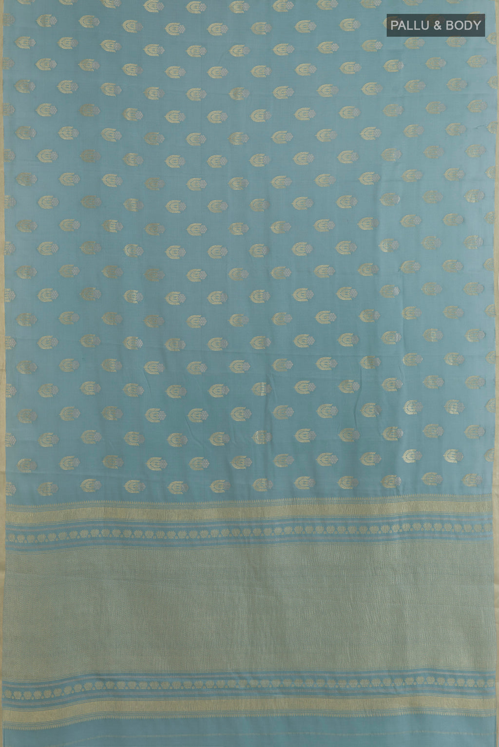Flat view of Light Blue Mysore Crepe Saree with Zari Butta on the body and Zari Border. 