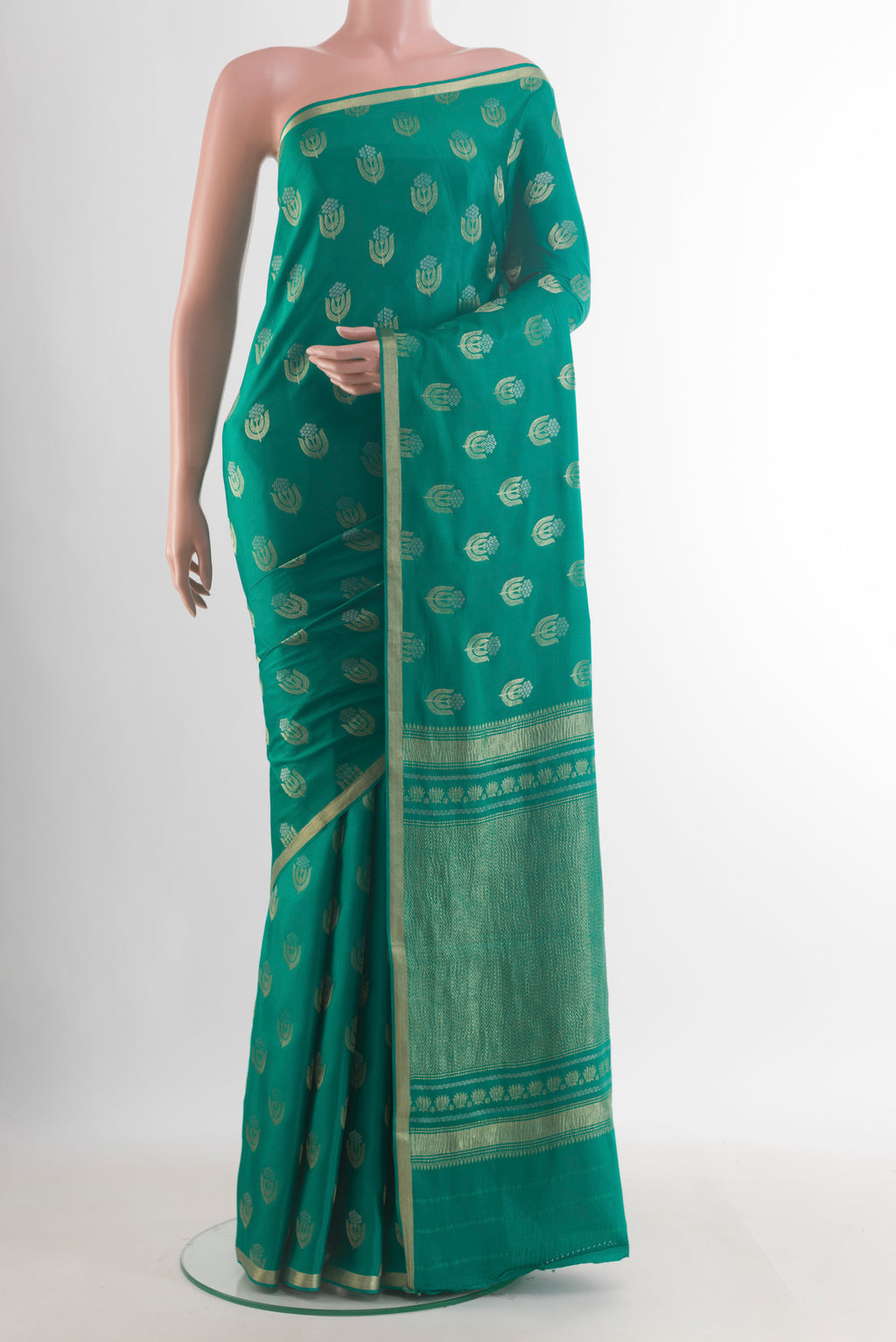 Sea Green Mysore Crepe Saree with Zari Butta on the body and Zari Border.  displayed on a mannequin