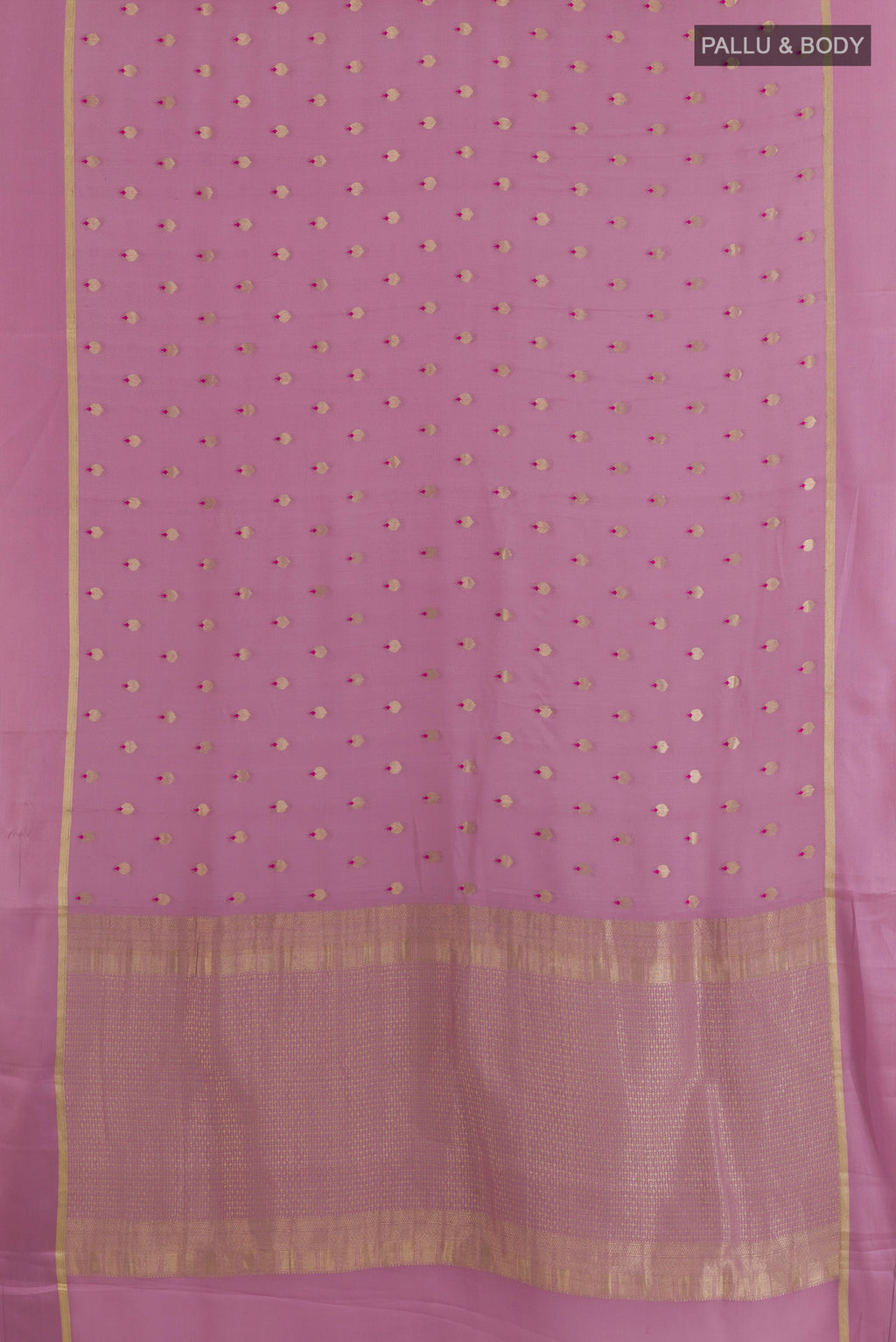 Flat view of Lavender Mysore Crepe Saree with Zari Butta on the body and Zari Border. 