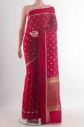 Red Mysore Crepe Saree with Zari Butta on the body and Zari Border.  displayed on a mannequin