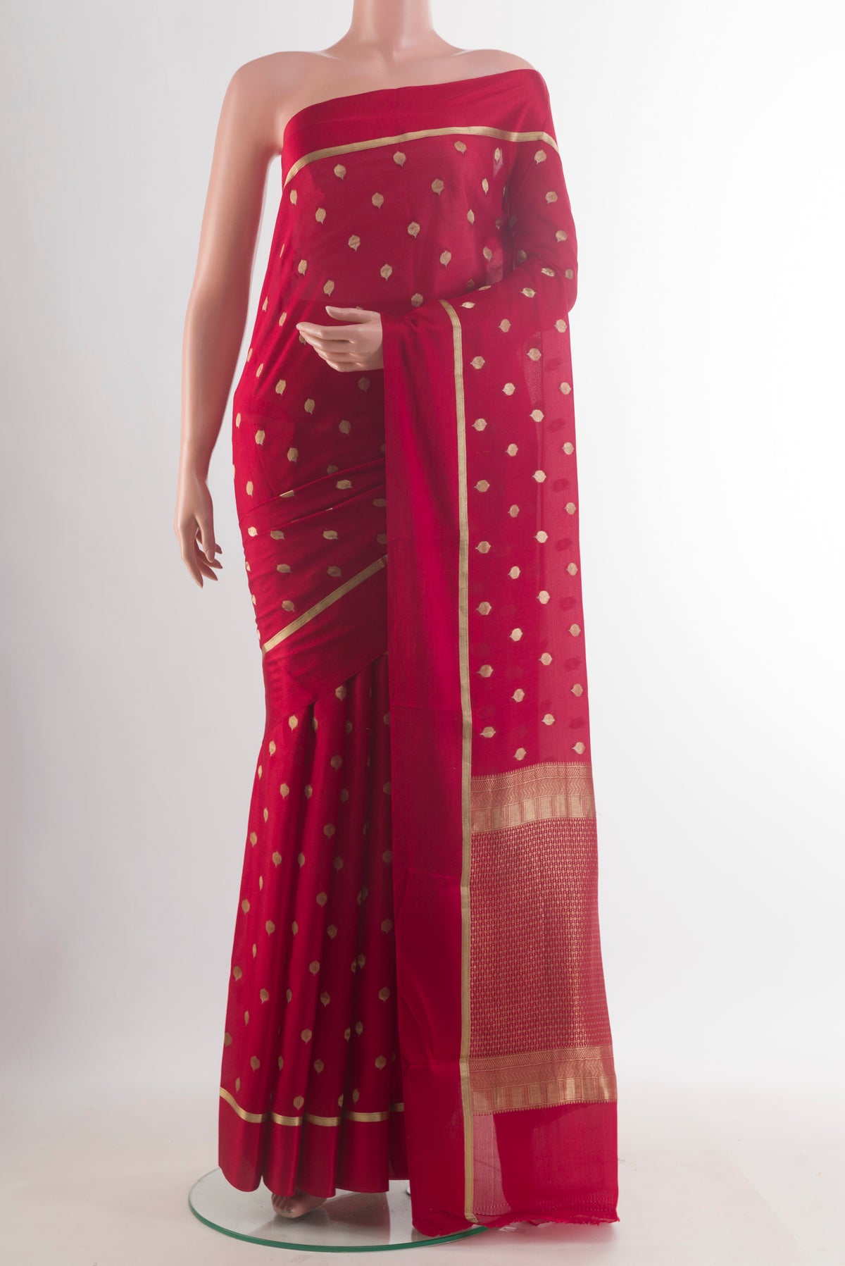 Red Mysore Crepe Saree with Zari Butta on the body and Zari Border.  displayed on a mannequin
