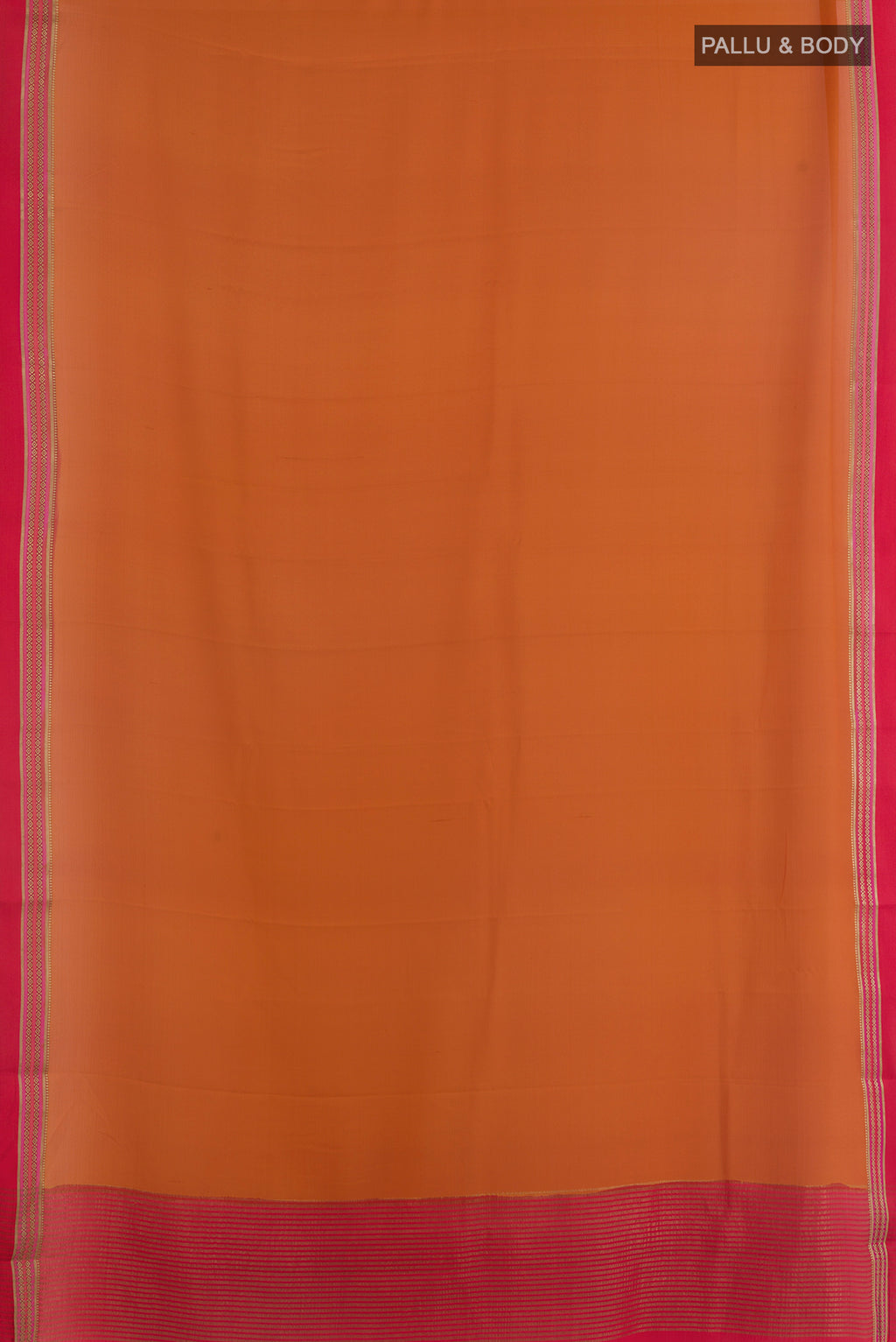 Flat view of Brick Orange Mysore Crepe Saree with Plain Body and Zari Border. 