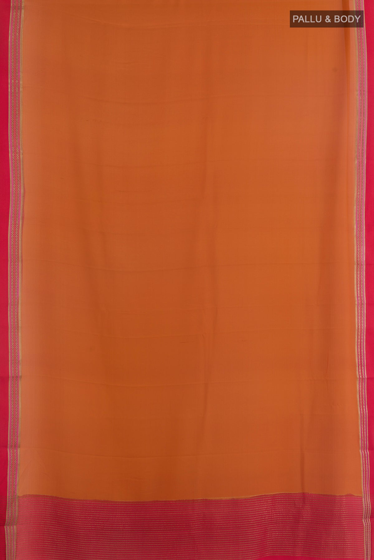 Flat view of Brick Orange Mysore Crepe Saree with Plain Body and Zari Border. 