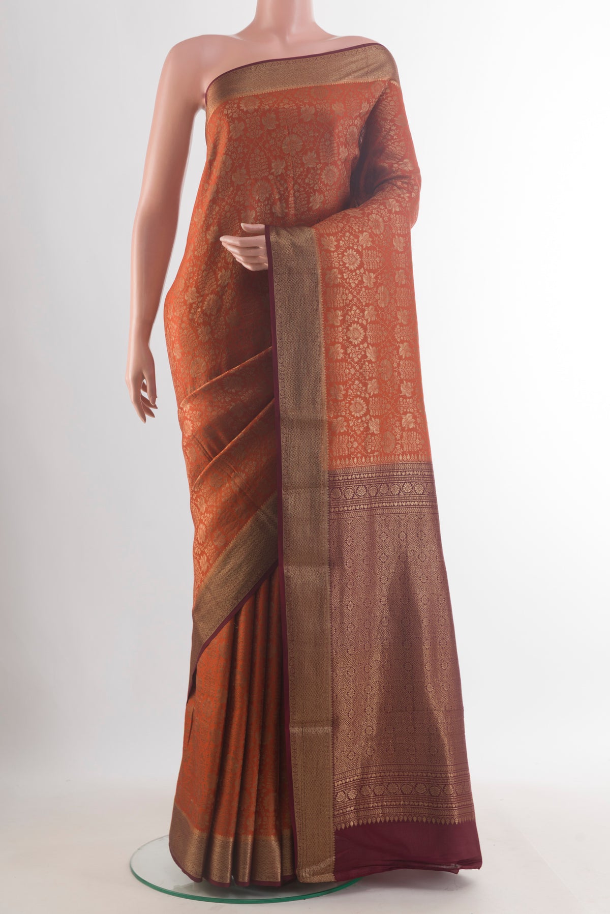 Rust Mysore Crepe Saree with Zari Brocade on the body and Zari Border.  displayed on a mannequin
