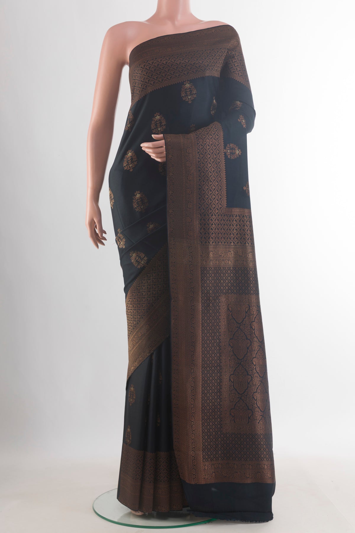 Black Mysore Crepe Saree with Zari Butta on the body and Zari Border.  displayed on a mannequin