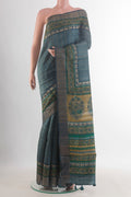 Blue Grey Tussar Saree with Checked design on the body and Zari Border.  displayed on a mannequin