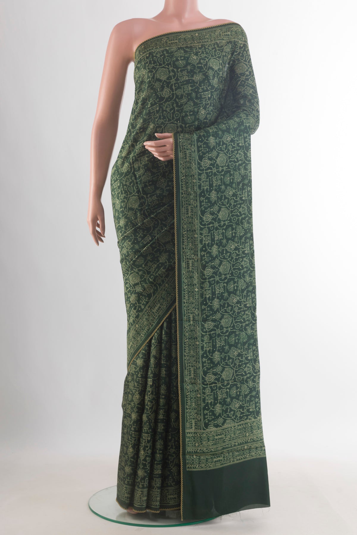 Pure Silk Bottle Green Printed Saree with Printed design on the body and Printed Border.  displayed on a mannequin