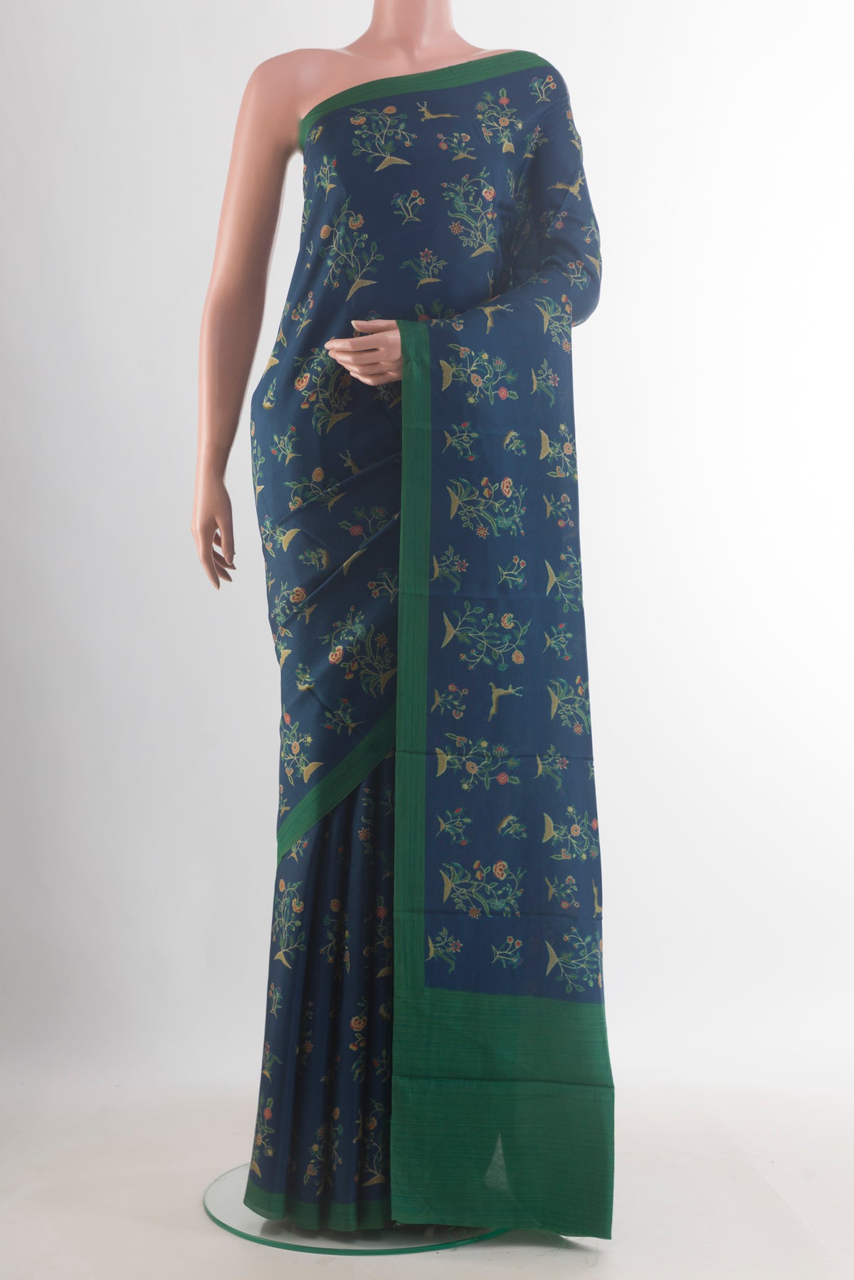 Pure Silk Navy Blue Printed Saree with Printed design on the body and Plain Border.  displayed on a mannequin