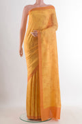 Pure Silk Yellow Printed Saree with Printed design on the body and Printed Border.  displayed on a mannequin