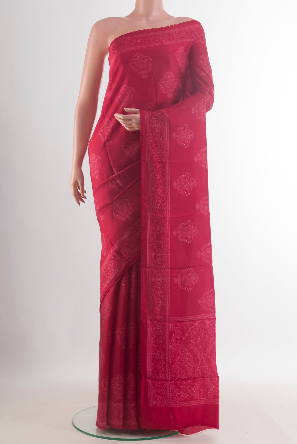Pure Silk Red Printed Saree with Printed design on the body and Printed Border.  displayed on a mannequin