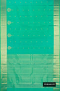 Sea Green Dual Tone Kanchipuram Silk Saree with Zari Butta on the body and Fancy Border.  displayed on a mannequin