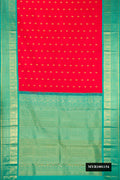 Red Dual Tone Kanchipuram Silk Saree with Zari Butta on the body and Fancy Border.  displayed on a mannequin