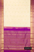 Sandal Dual Tone Kanchipuram Silk Saree with Zari Butta on the body and Zari Border.  displayed on a mannequin