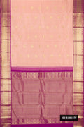 Golden Peach Dual Tone Kanchipuram Silk Saree with Zari Butta on the body and Zari Border.  displayed on a mannequin