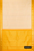 Beige Dual Tone Kanchipuram Silk Saree with Plain Body and Zari Border.  displayed on a mannequin