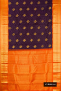 Navy Blue Dual Tone Kanchipuram Silk Saree with Zari Butta on the body and Zari Border.  displayed on a mannequin