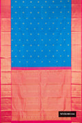 Blue Dual Tone Kanchipuram Silk Saree with Zari Butta on the body and Zari Border.  displayed on a mannequin