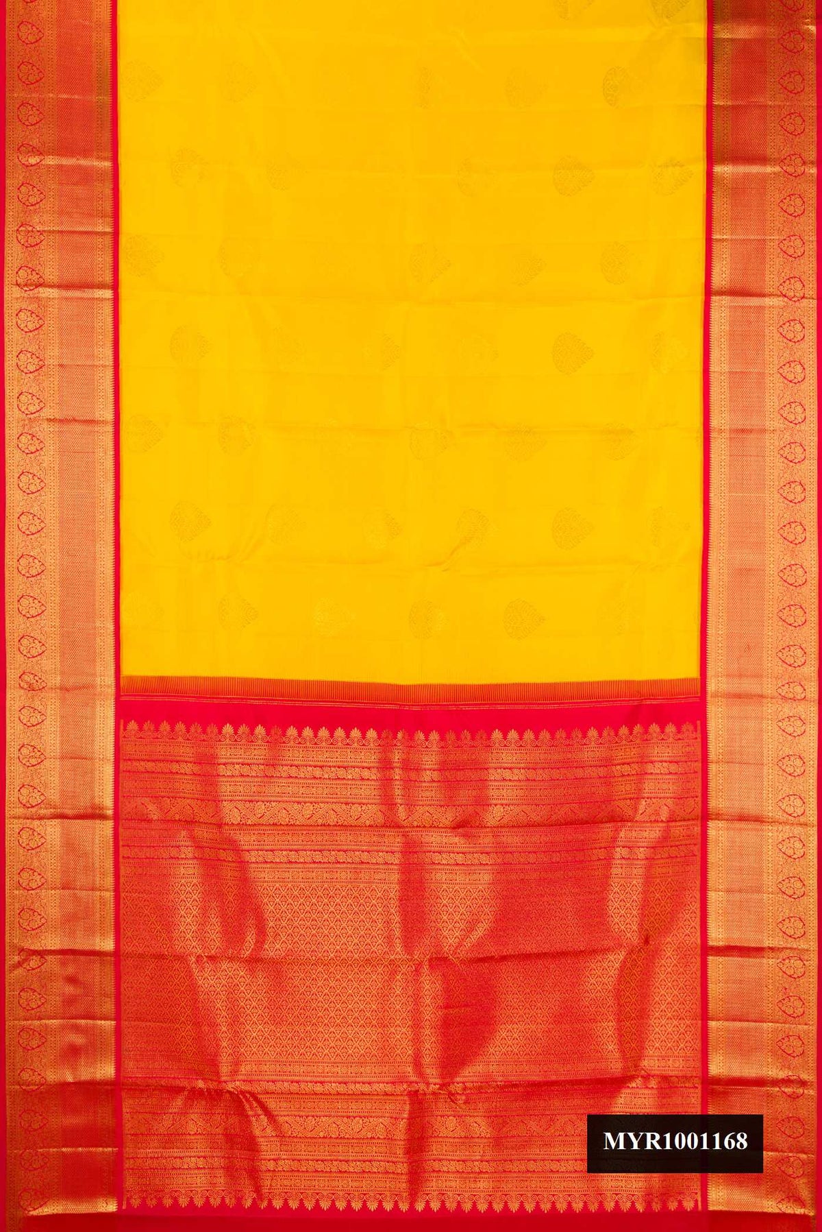 Yellow Dual Tone Kanchipuram Silk Saree with Zari Butta on the body and Zari Border.  displayed on a mannequin
