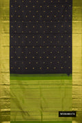 Black Dual Tone Kanchipuram Silk Saree with Zari Butta on the body and Zari Border.  displayed on a mannequin