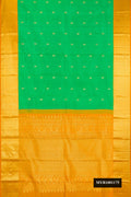 Parrot Green Dual Tone Kanchipuram Silk Saree with Zari Butta on the body and Zari Border.  displayed on a mannequin