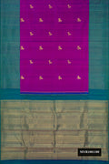 Peacock Blue Dual Tone Kanchipuram Silk Saree with Zari Butta on the body and Zari Border.  displayed on a mannequin