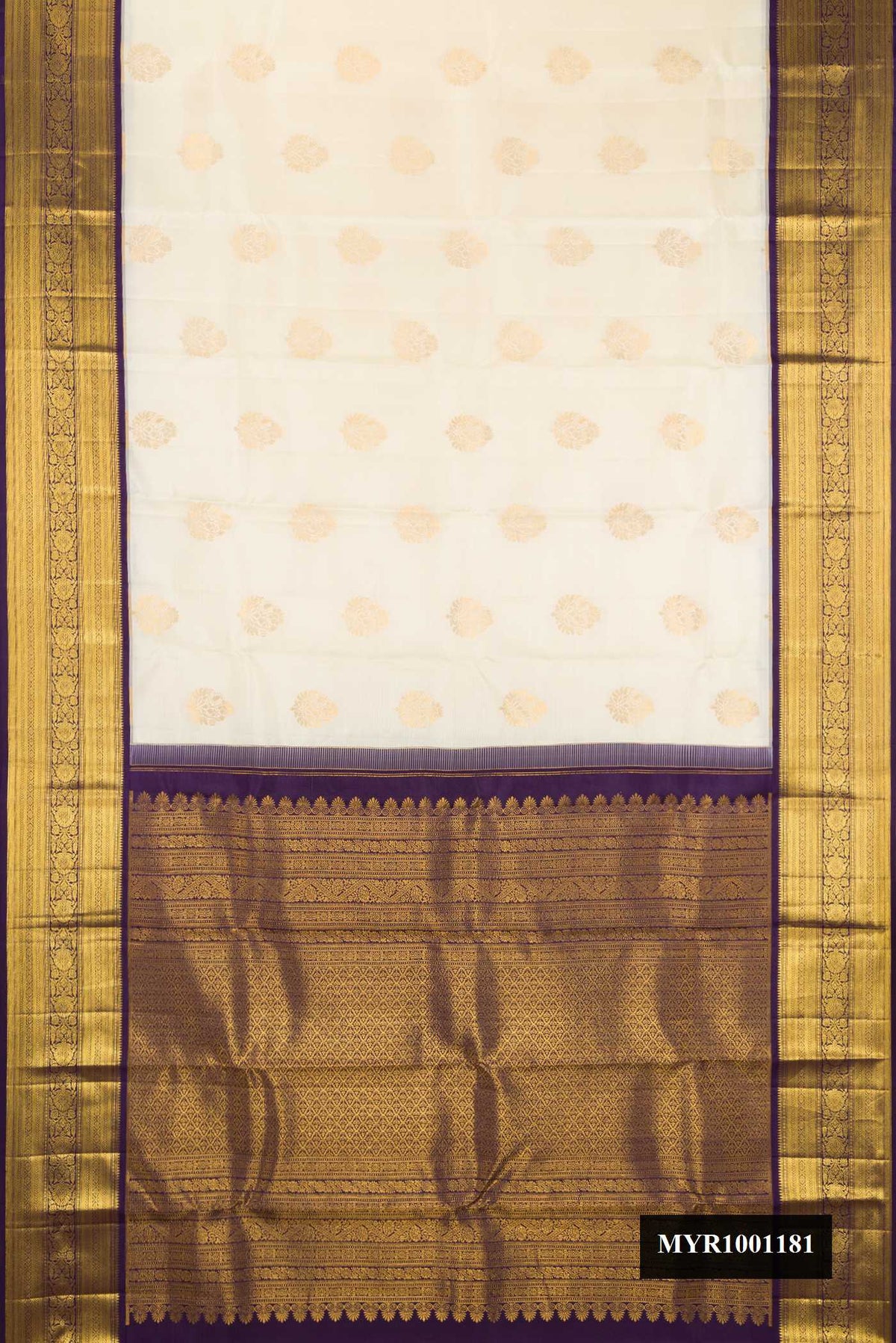 Off White Dual Tone Kanchipuram Silk Saree with Zari Butta on the body and Zari Border.  displayed on a mannequin