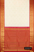 Sandal Dual Tone Kanchipuram Silk Saree with Zari Butta on the body and Zari Border.  displayed on a mannequin