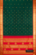 Bottle Green Dual Tone Kanchipuram Silk Saree with Zari Butta on the body and Zari Border.  displayed on a mannequin