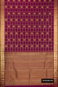 Magenta Dual Tone Kanchipuram Silk Saree with Checked design on the body and Zari Border.  displayed on a mannequin