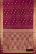 Magenta Dual Tone Kanchipuram Silk Saree with Checked design on the body and Zari Border.  displayed on a mannequin