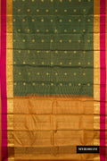 Bottle Green Dual Tone Kanchipuram Silk Saree with Checked design on the body and Zari And Thread Border.  displayed on a mannequin