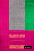 Black and White Dual Tone Kanchipuram Silk Saree with Checked design on the body and Ganga Jamuna Border.  displayed on a mannequin