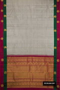 Grey Dual Tone Kanchipuram Silk Saree with Checked design on the body and Fancy Border.  displayed on a mannequin