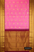 Rose pink Dual Tone Kanchipuram Silk Saree with Zari Butta on the body and Fancy Border.  displayed on a mannequin