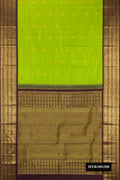 Parrot Green Dual Tone Kanchipuram Silk Saree with Zari Butta on the body and Fancy Border.  displayed on a mannequin