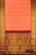 Orange Dual Tone Kanchipuram Silk Saree with Zari Butta on the body and Zari Border.  displayed on a mannequin